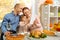 A happy family have a thanksgiving dinner and sends a video greeting to their parents
