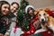 happy family having fun with gift and funny dog at christmas tree. emotional moments. merry christmas and happy new year