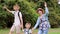 Happy family hiking through the forest