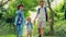 Happy family hiking through the forest