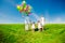 Happy family holding colorful balloons outdoor. Mom, ded and two