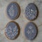 Happy family holiday, gingerbread easter gray cookies in form eggs with floral pattern. Festive cookies on gray background.