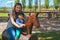 Happy family horse ranch petting zoo trip background mother and baby child ride