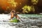 Happy family kayaking at tropical islands