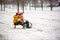 Happy family with kids, having fun outdoor in the snow on Christmas, playing with sledge