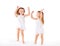 Happy family . kids twin sisters jumping on the bed, playing an