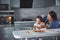 Happy family in the kitchen. Holiday food concept. Mother and daughter decorate cookies. Happy family in making homemade