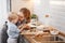 Happy family in kitchen. mother and child baking cookies