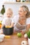 Happy family in the kitchen. Mother and child daughter cooking pasta