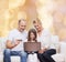 Happy family with laptop computer and credit card