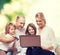 Happy family with laptop computer and credit card