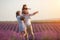 Happy family in laveder field. mother, father and child in sunset light in blooming lavender