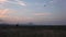 Happy Family Lifting Chinese Lantern on Sky Playing Outdoor at Sunset, Mountains