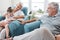 Happy family, love and grandparents with child relax, bond and enjoy fun quality time together on home living room sofa