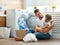 Happy family man father householder and child in laundry with