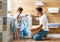 Happy family man father householder and child in laundry with