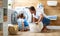 Happy family man father householder and child in laundry with