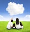 Happy family on a meadow with cloud background