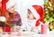 Happy family mother and child daughter write aletter to Santa o