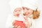 Happy family mother and daughter in hats with Christmas present in winter