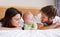 Happy family, mother and father with baby on bed for love, care and fun quality time together at home. Parents, cute