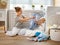 Happy family mother housewife and baby son in laundry load