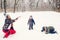 Happy family mother and sons having fun, playing with snow at winter walk outdoors. Happy christmas holidays. Winter snowy weather