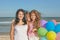 Happy family. Mother, youngest daughter and an seventeen-year-old daughter with Down syndrome.