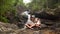 Happy family near the waterfall