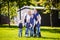 Happy Family Outdoors. Happy Caucasian family standing outside their house and hugging. Family with four children in front house.