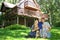 Happy Family Outside by Cabin