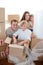 Happy family packing boxes during a removal