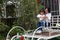 Happy family parental activity mother daughter hand in hand play and have fun outdoor in summer park child parent love girl