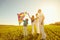 Happy family playing with a kite on nature in spring, summer.