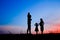 Happy family playing on nature summer silhouette