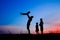 Happy family playing on nature summer silhouette