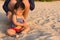 Happy family playing sand on the beach.