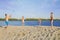 Happy family plays beach volleyball on the sand. The concept of a healthy lifestyle