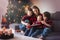 Happy family portrait on Christmas, mother, reading a book to he