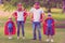 Happy family pretending to be superhero