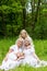 Happy family resting on the nature in the summer