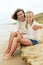 Happy family resting on a sandy beach