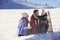 The happy family rides the sledge in the winter wood, cheerful winter entertainments