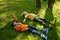 Happy family of rollerskaters lying on green grass in park and having rest