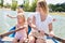 Happy family in the rowboat on a lake