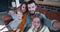 Happy family selfie together, young Caucasian father and mother taking photo with three children at home slow motion.