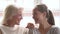 Happy family senior mature mother and young woman talking laughing