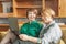 Happy family. Senior mother and mature daughter with laptop at home