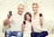 Happy family showing smartphones blank screens