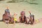 Happy family in snorkels on tropical beach